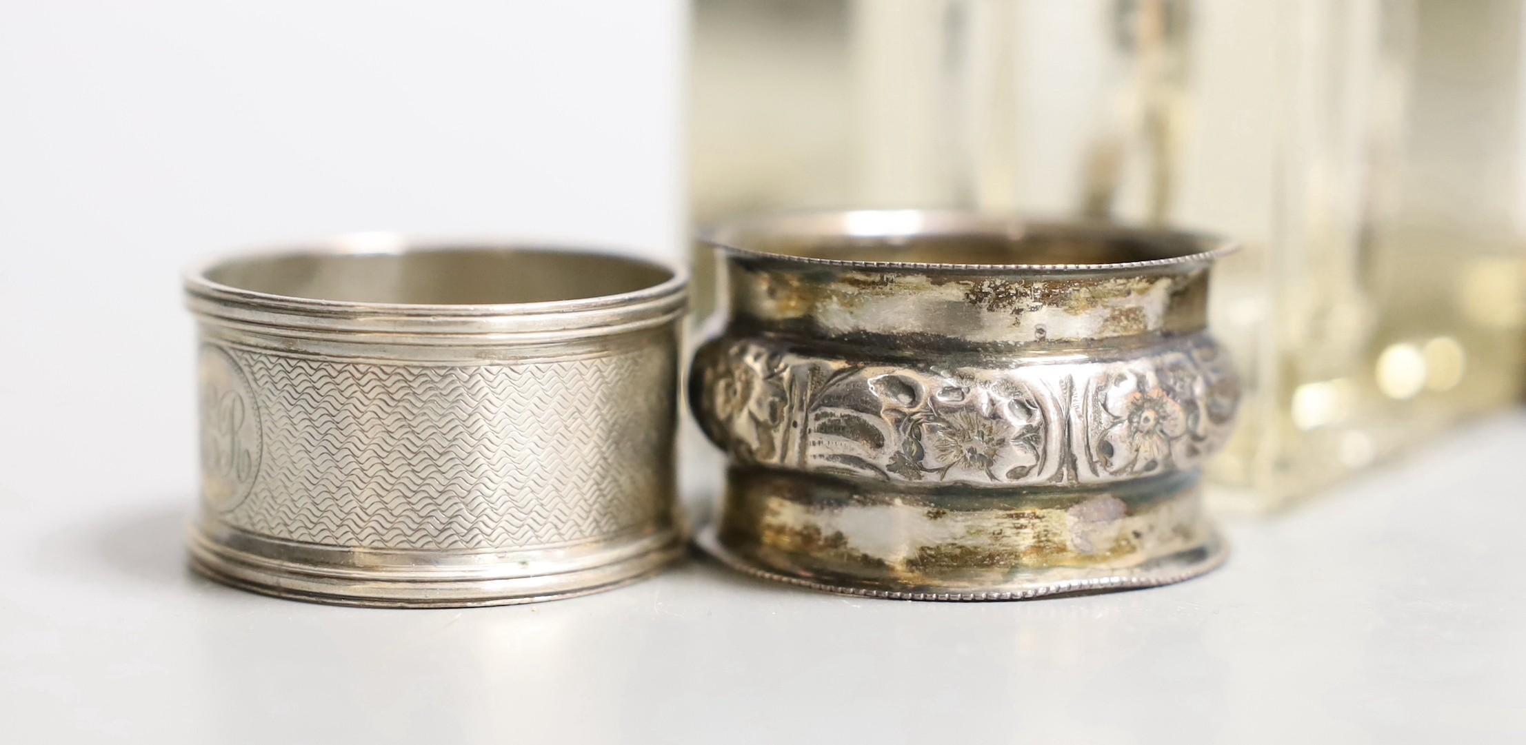 A George V silver mounted cut glass inkwell by William Hutton & Sons, Sheffield, 1910, width 67mm, two silver napkin rings and a silver mounted book of Common Prayer.